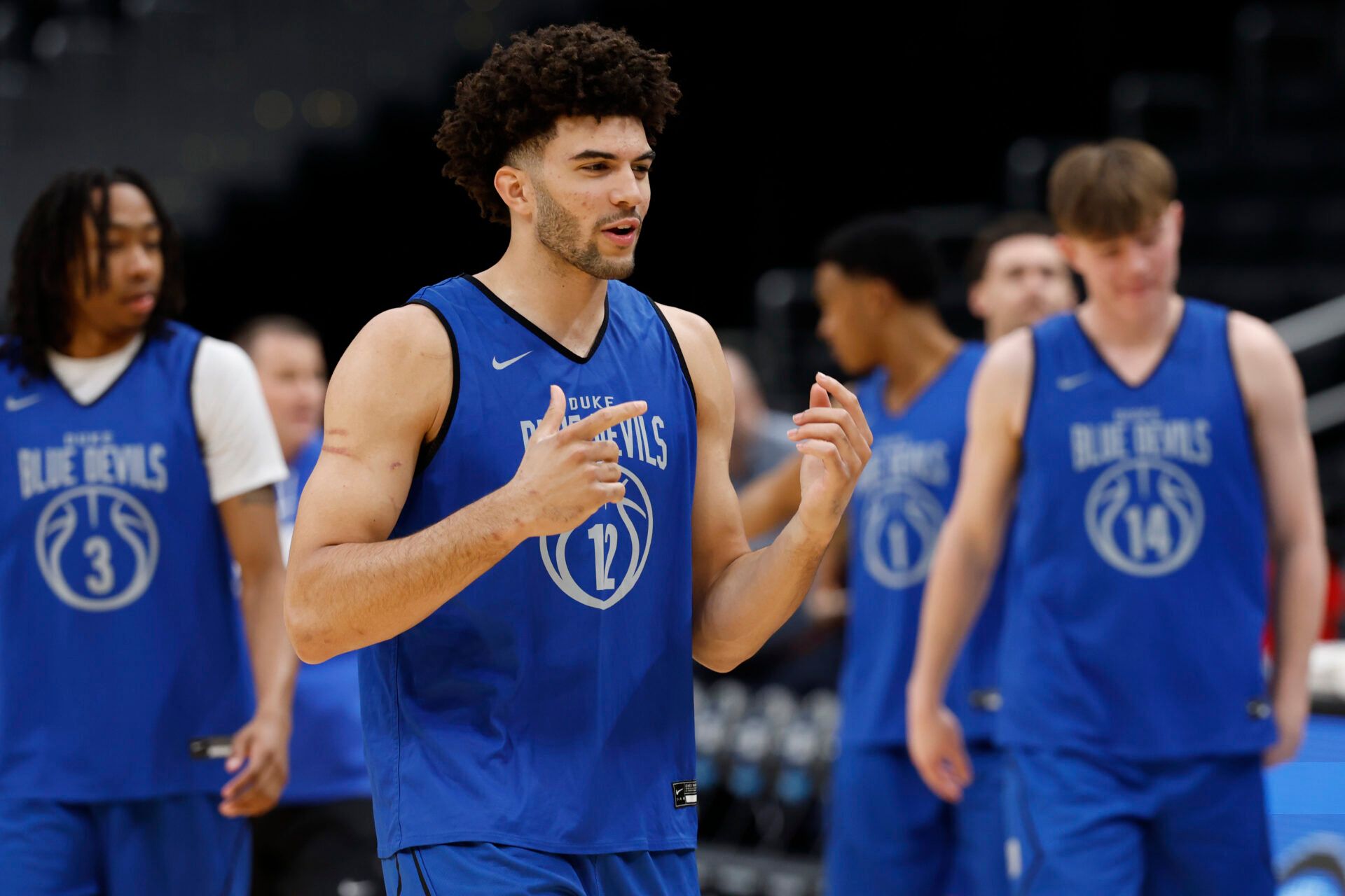 Duke Blue Devils forward Cameron Boozer (12) jokes with teammates during a practice session ahead of the east regional of the men's 2026 NCAA Tournament at Capital One Arena.