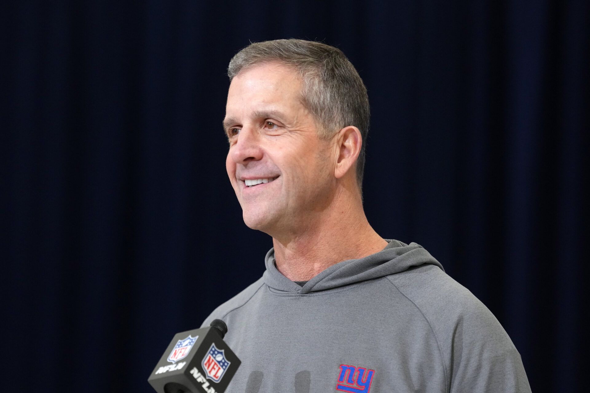 New York Giants coach John Harbaugh speaks at the NFL Scouting Combine at the Indiana Convention Center.