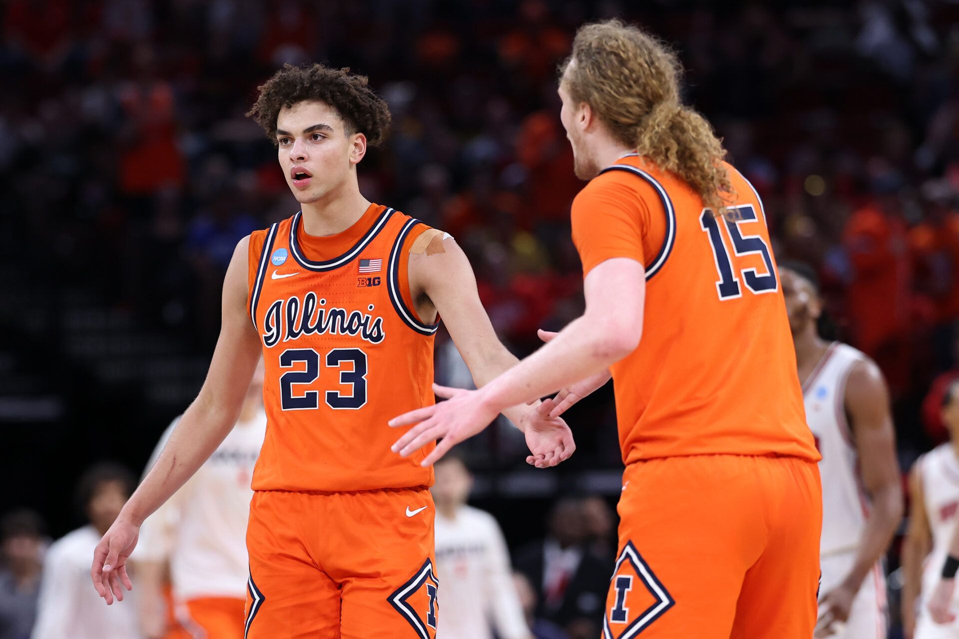 Illinois Fighting Illini guard Keaton Wagler (23) reacts against the Houston Cougars in the first half during a Sweet Sixteen game of the South Regional of the men's 2026 NCAA Tournament at Toyota Center.