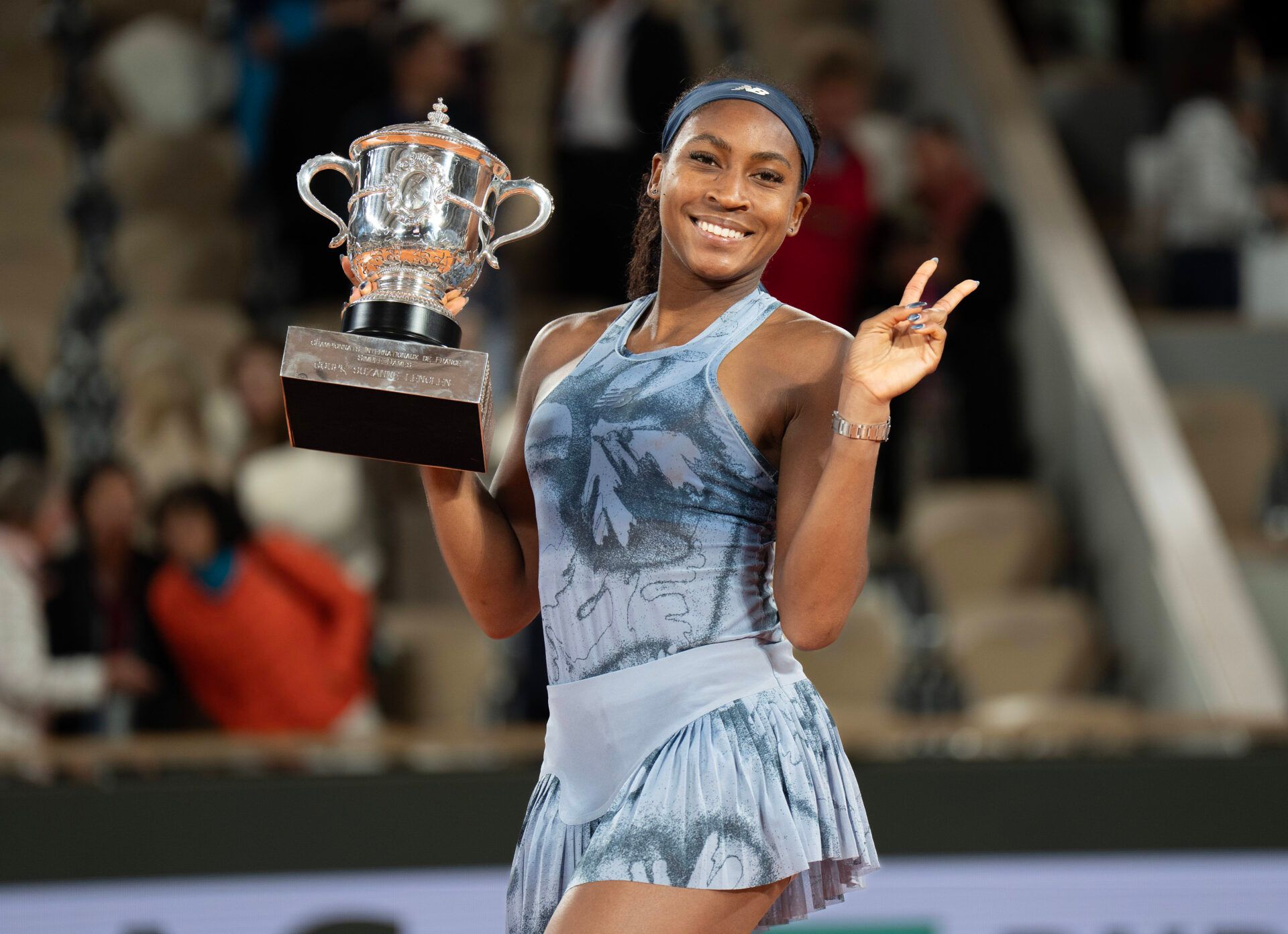 Coco Gauff of the United States poses with the trophy after winning the womenÕs singles final against Aryna Sabalenka on day 14 at Roland Garros Stadium.