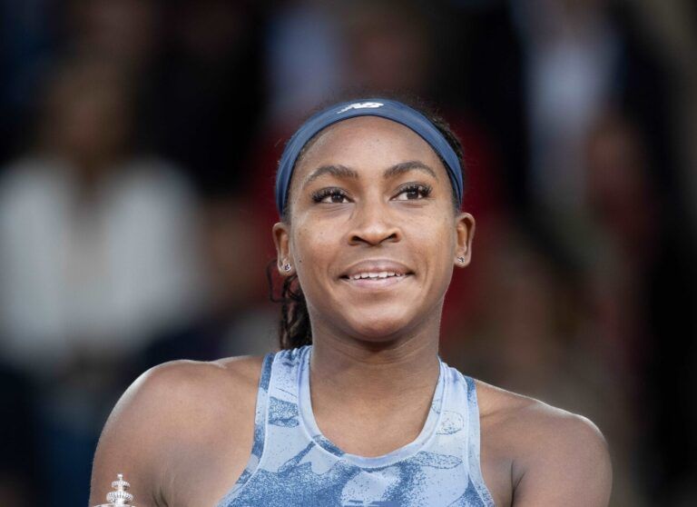 Coco Gauff of the United States poses with the trophy after winning the womens singles final against Aryna Sabalenka on day 14 at Roland Garros Stadium.