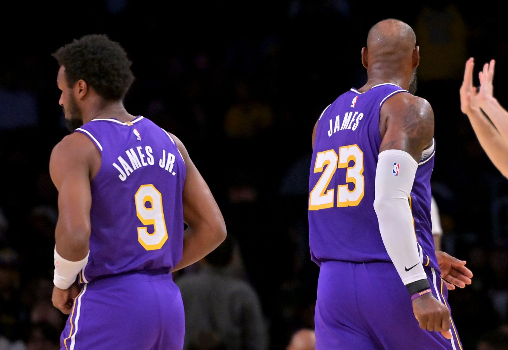 Los Angeles Lakers guard Bronny James (9) enters the game as forward Lebron James (23) heads to the bench during the final minutes of the game against the San Antonio Spurs at Crypto.com Arena.