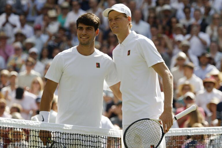 Carlos Alcaraz (ESP)(L) and Jannik Sinner (ITA)(R) pose for a picture prior to their gentlemen's' singles final of The Championships Wimbledon 2025 at All England Lawn Tennis and Croquet Club.