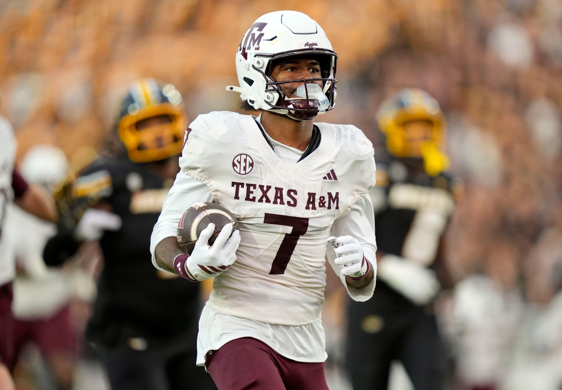 Texas A&M Aggies wide receiver KC Concepcion (7) runs for a touchdown during the second half against the Missouri Tigers at Faurot Field at Memorial Stadium.