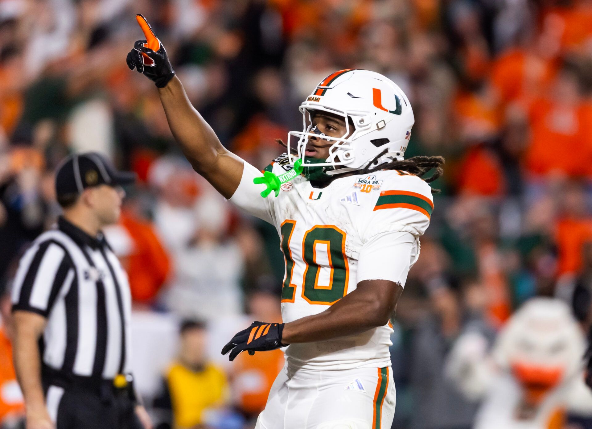 Miami Hurricanes wide receiver Malachi Toney (10) celebrates after scoring a touchdown against the Indiana Hoosiers during the College Football Playoff National Championship game at Hard Rock Stadium.
