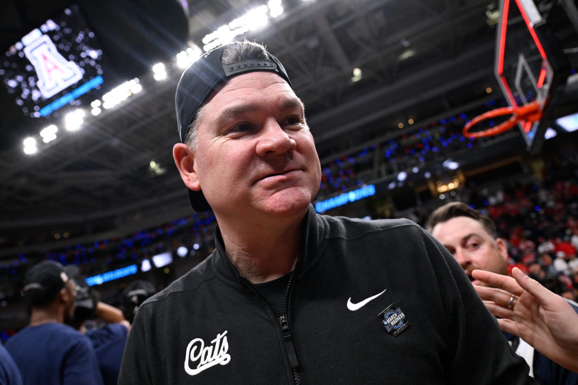 Arizona Wildcats head coach Tommy Lloyd walks off the court after an Elite Eight game against the Purdue Boilermakers of the West Regional of the men's 2026 NCAA Tournament at SAP Center.