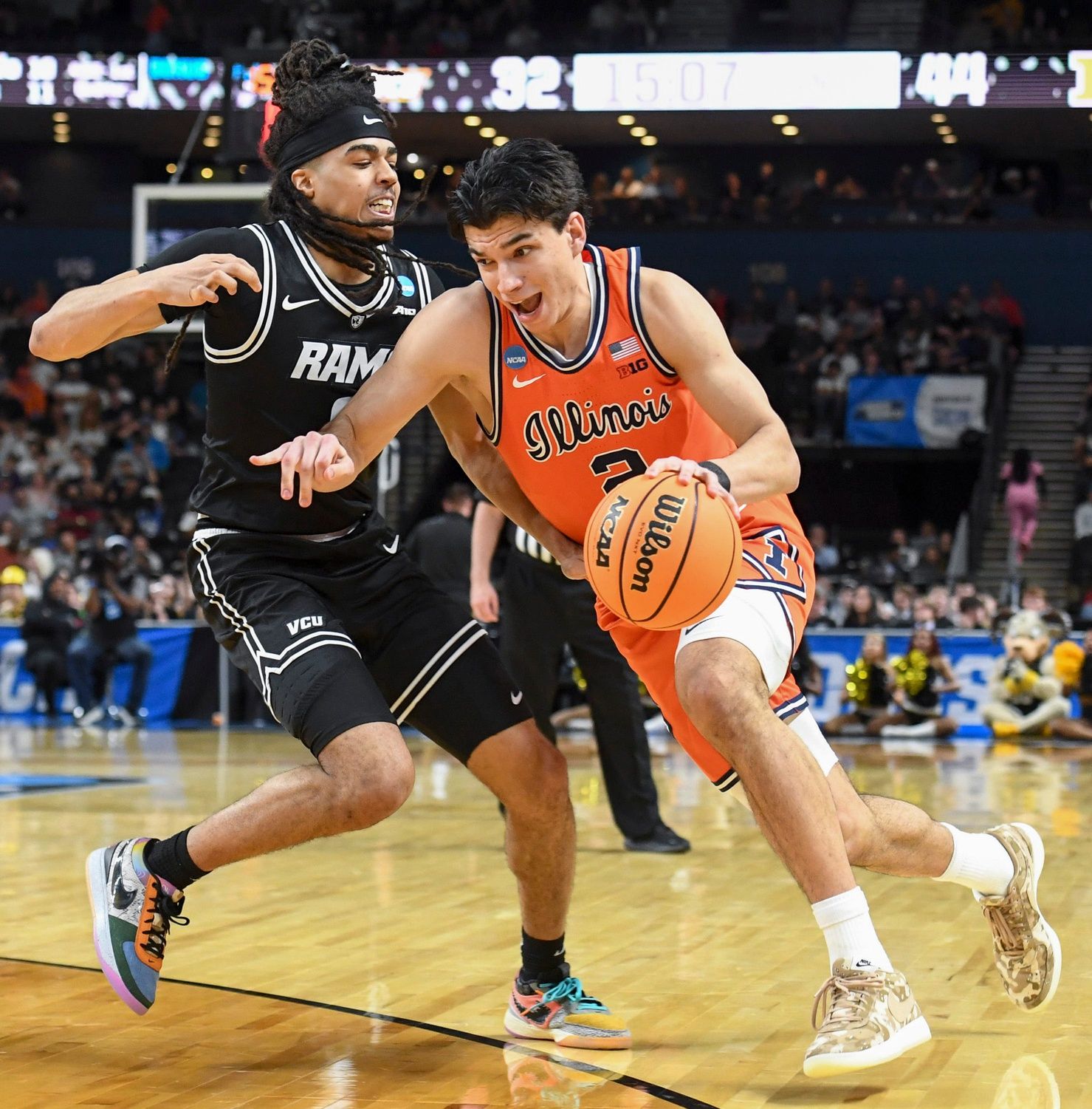 VCU Rams guard Brandon Jennings (0) defends Illinois Fighting Illini guard Andrej Stojakovic (2) Saturday, March 21, 2026, during the NCAA Men’s Basketball Tournament second round game at Bon Secours Wellness Arena in Greenville, South Carolina.