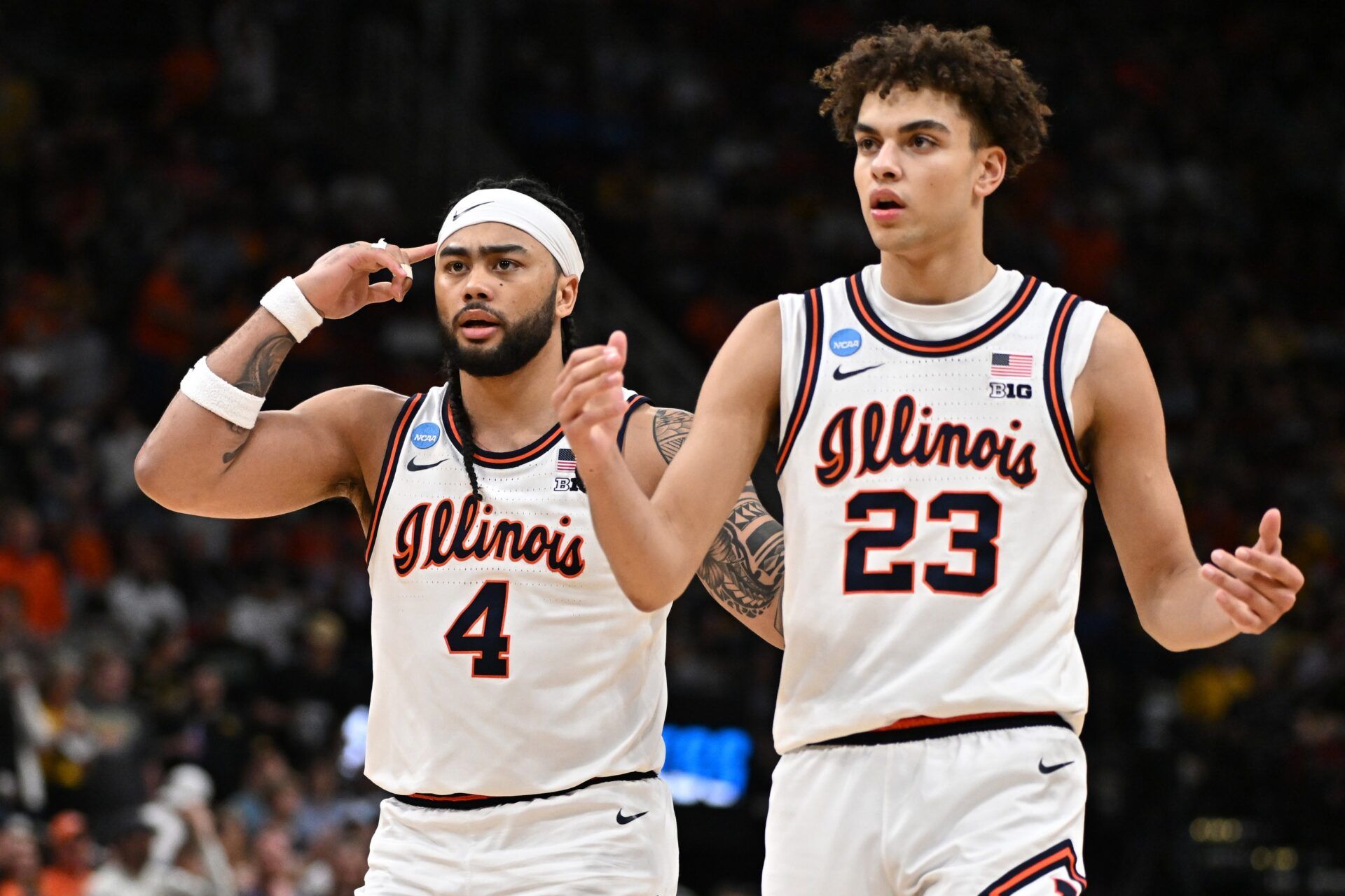 Illinois Fighting Illini guard Kylan Boswell (4) and guard Keaton Wagler (23) react in the second half against the Iowa Hawkeyes during an Elite Eight game of the South Regional of the men's 2026 NCAA Tournament at Toyota Center.