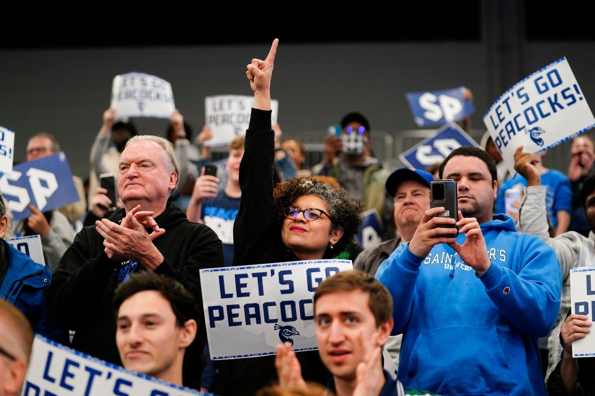A couple hundred fans welcome home the players of the Saint Peter's University men's basketball team on Sunday, March 20, 2022, in Jersey City after their second-round win in the NCAA tournament.

News St Peter S Basketball Players Come Home