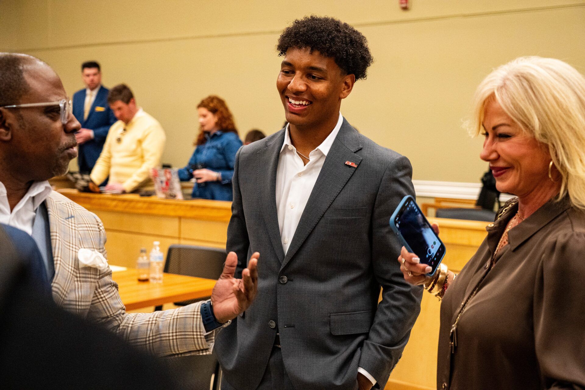 Ole Miss quarterback Trinidad Chambliss talks with supporters after the hearing of Chambliss in his lawsuit against the NCAA at Calhoun County Courthouse in Pittsboro, Miss., on Thursday, Feb. 12, 2026. Chambliss was granted a preliminary injunction against the NCAA.