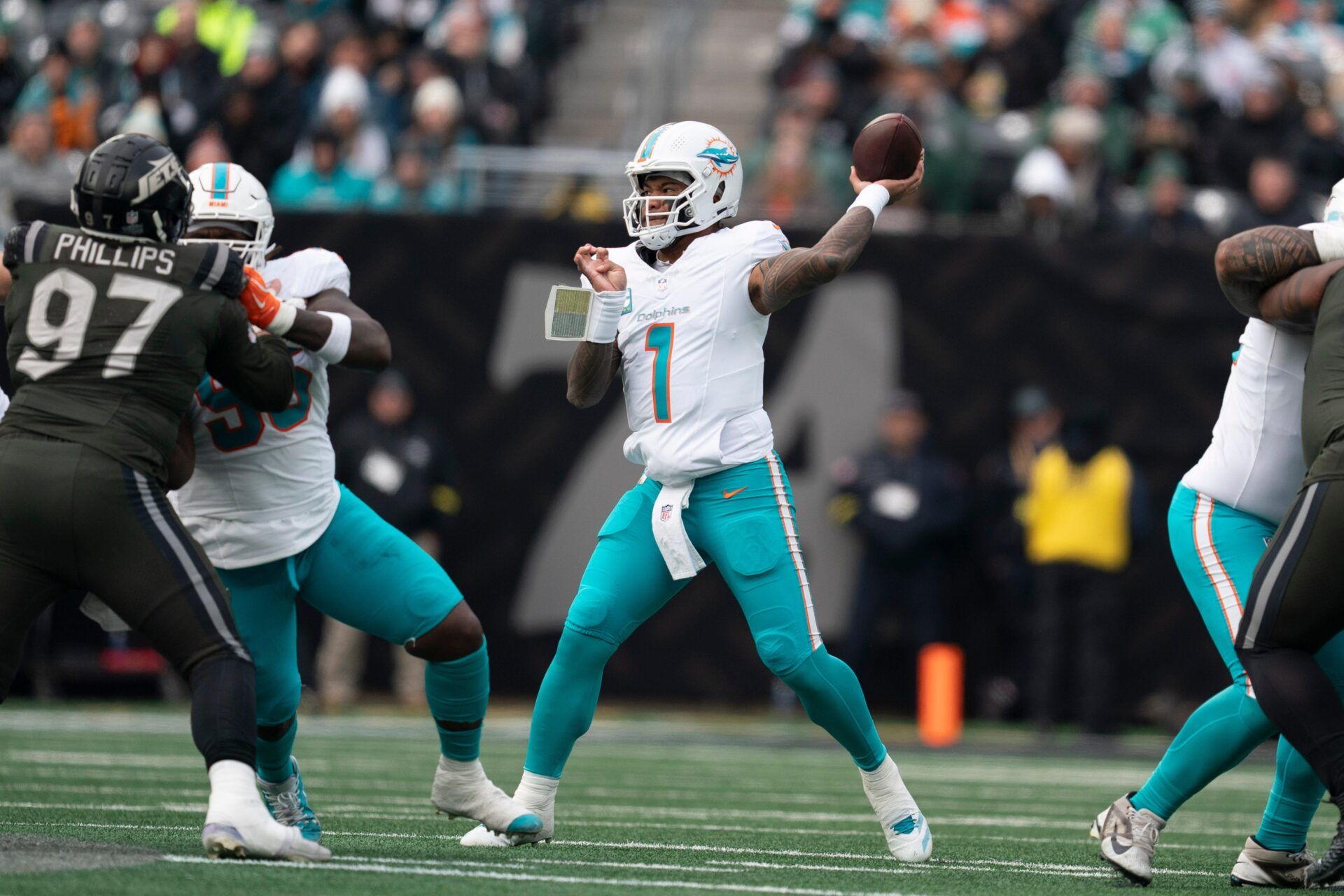 Miami Dolphin's quarterback Tua Tagovailoa (1) looks to pass the ball during a week 14 football game between the New York Jets and Miami Dolphins at MetLife Stadium on Sunday, Dec. 7, 2025.