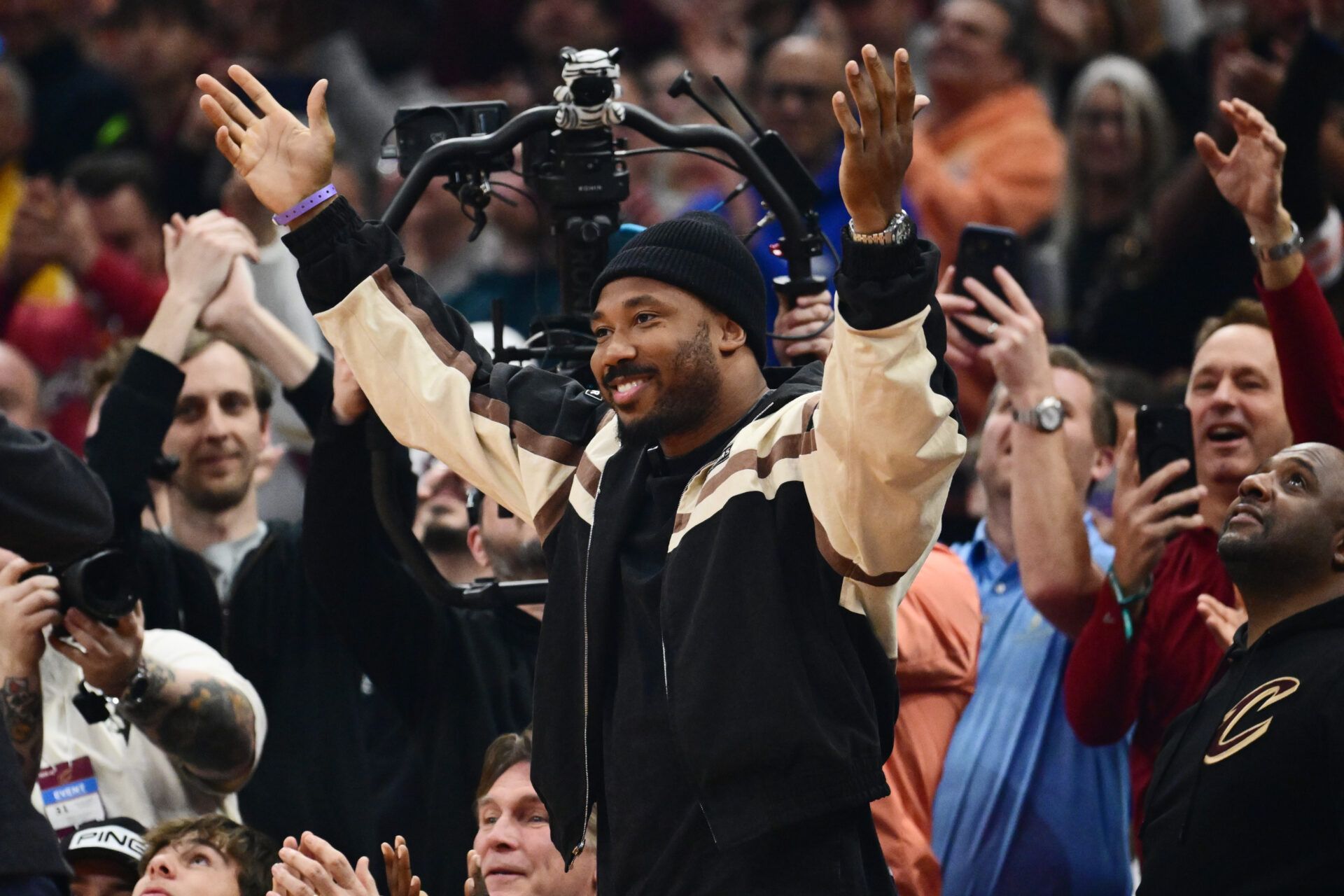 Cleveland Browns player Myles Garrett acknowledges the crowd during the first half of the game between the Cleveland Cavaliers and the New York Knicks at Rocket Arena.
