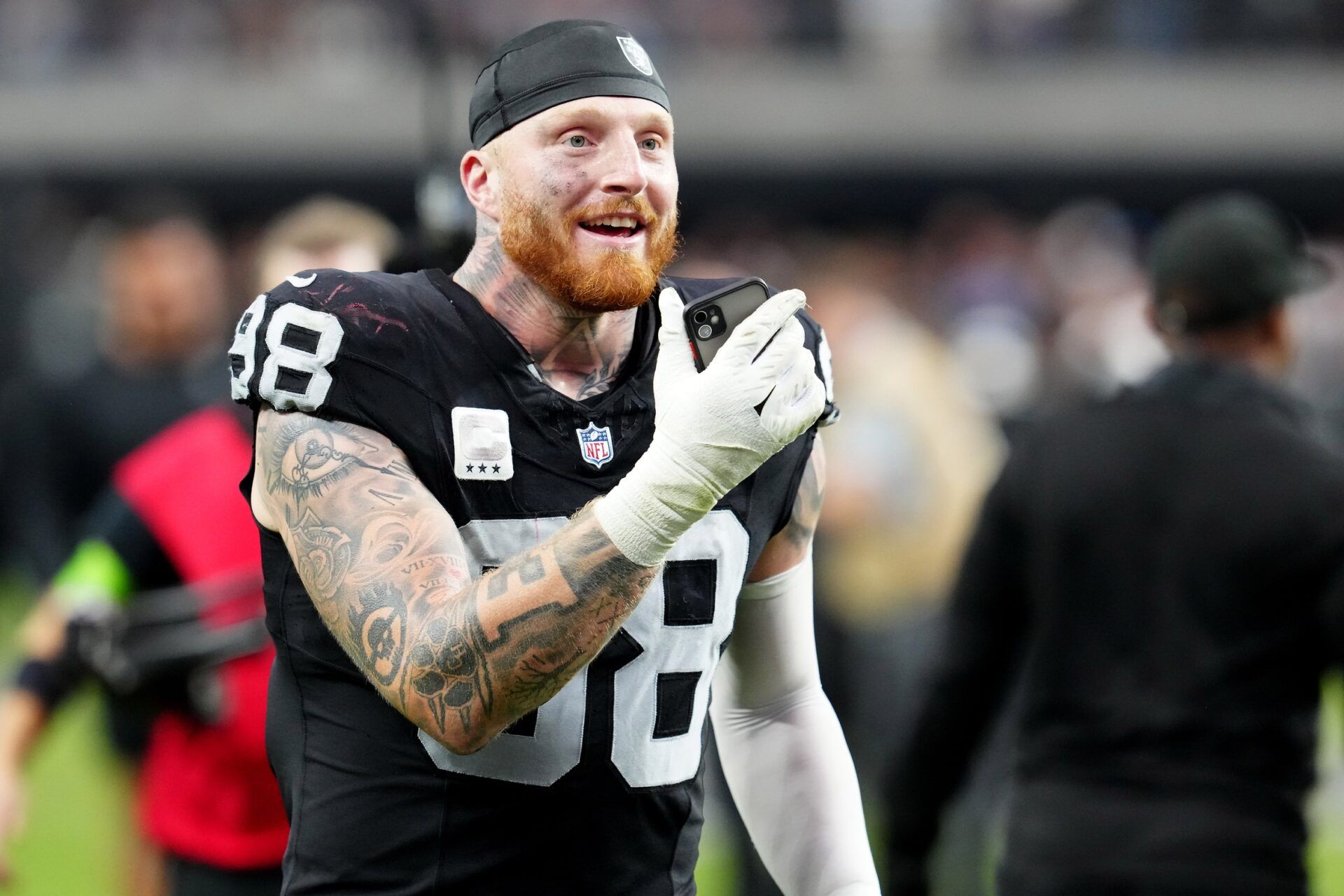 Las Vegas Raiders defensive end Maxx Crosby (98) celebrates after the Raiders defeated the New England Patriots 21-17 at Allegiant Stadium.