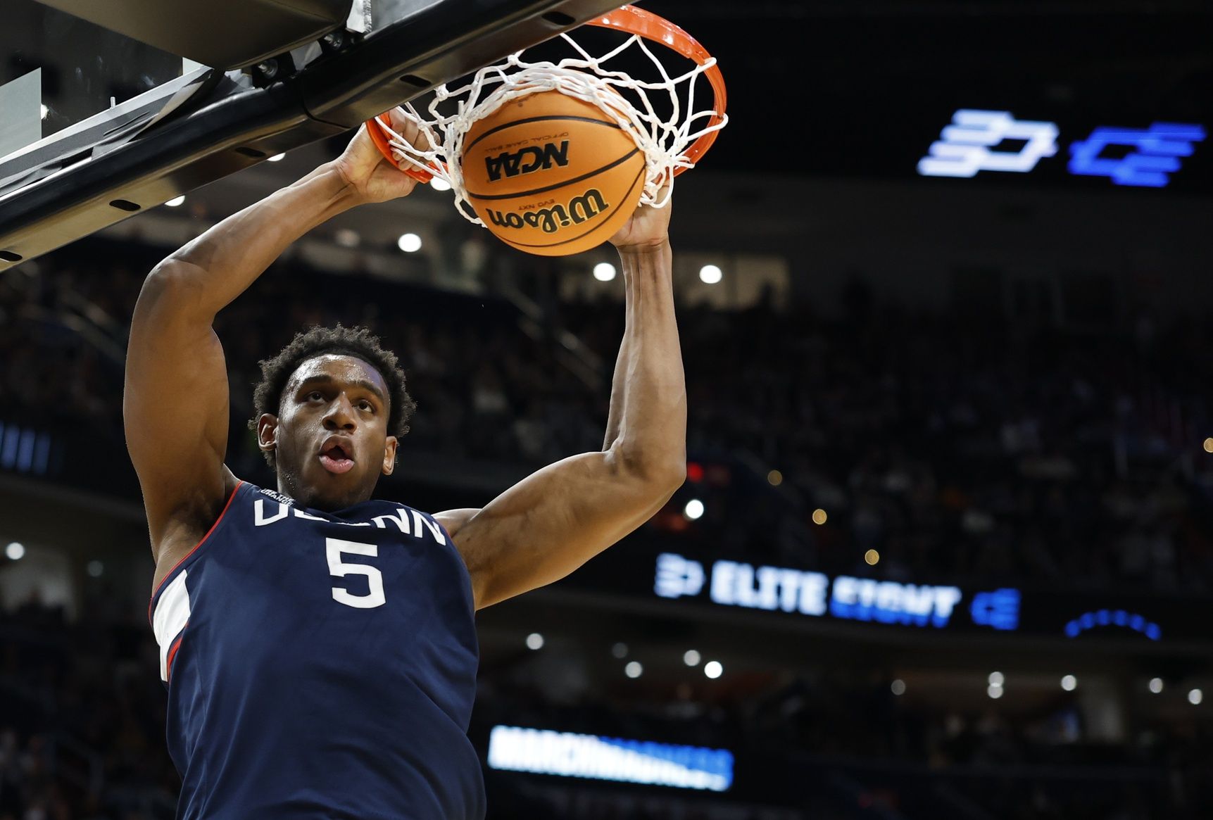 UConn Huskies forward Tarris Reed Jr. (5) dunks the ball against the Duke Blue Devils in the second half during an Elite Eight game of the East Regional of the men's 2026 NCAA Tournament at Capital One Arena.