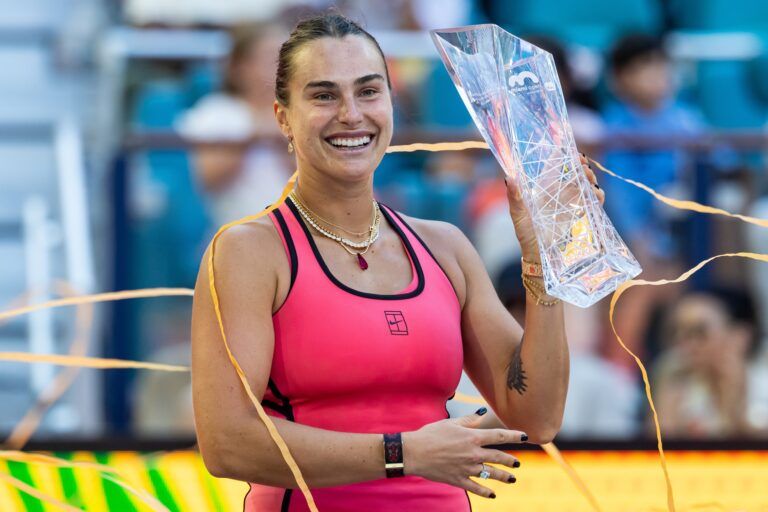 Aryna Sabalenka of Belarus poses with the Butch Buchholz Championship trophy after defeating Coco Gauff of the United States in the final of the womenÕs singles at the Hard Rock Stadium.