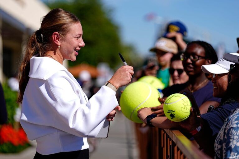 Amanda Anisimova signs her autograph for fans during the BNP Paribas Open in Indian Wells, Calif., on Wednesday, March 4, 2026.