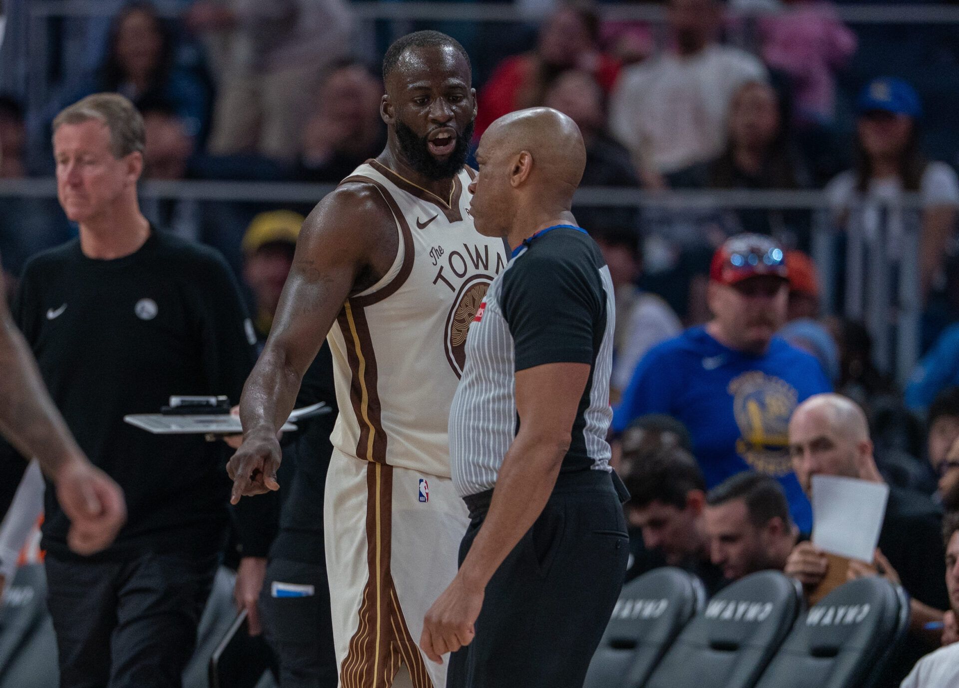 Golden State Warriors forward Draymond Green (23) talks with a referee after a foul against the Washington Wizards during the fourth quarter at Chase Center.