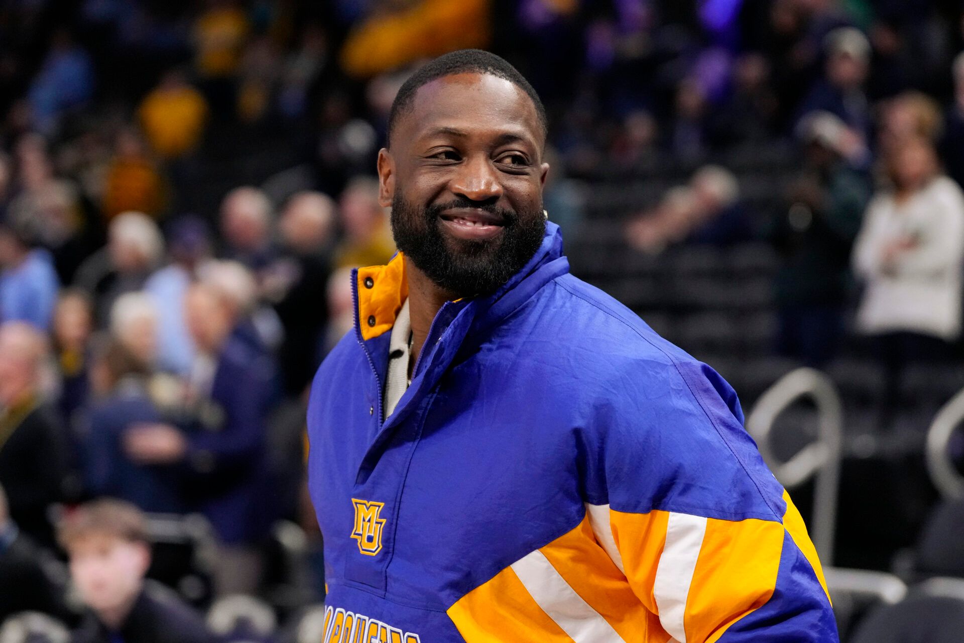 Former Marquette player Dwyane Wade looks on prior to the game against the Butler Bulldogs at Fiserv Forum.