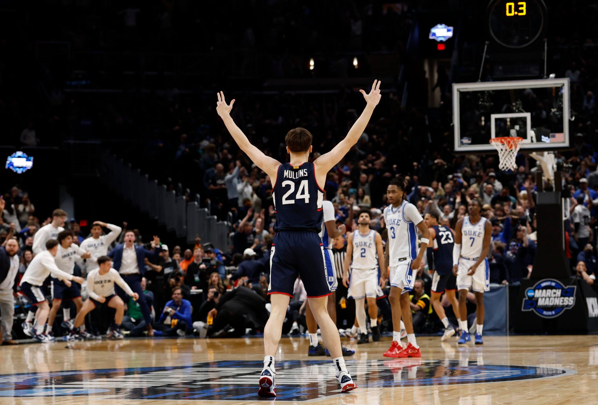 UConn Huskies guard Braylon Mullins (24) celebrates after making the game-winning three-point basket against the Duke Blue Devils in the second half during an Elite Eight game of the East Regional of the men's 2026 NCAA Tournament at Capital One Arena.