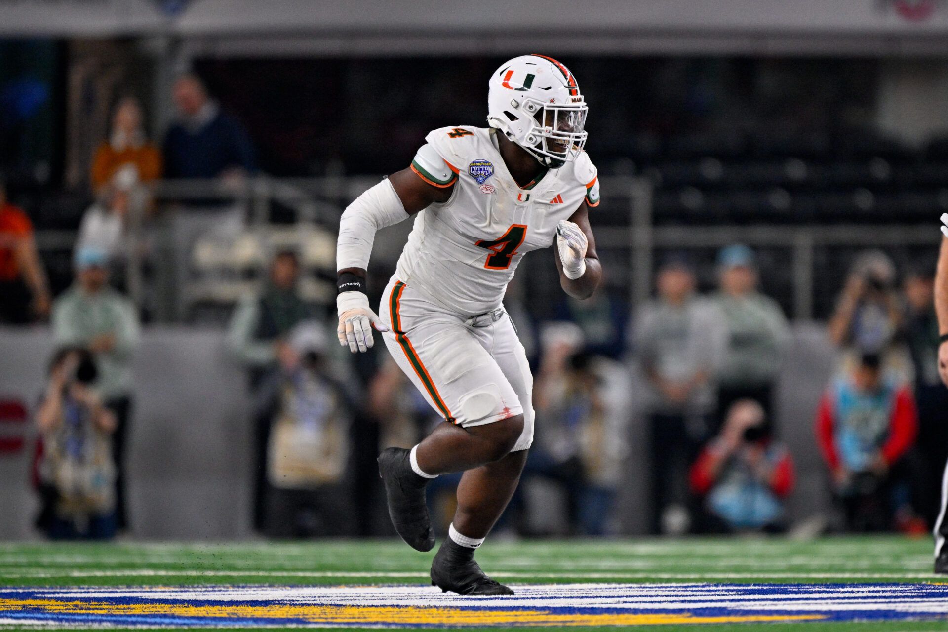 Miami Hurricanes defensive lineman Rueben Bain Jr. (4) rushes the line during the 2025 Cotton Bowl and quarterfinal game of the College Football Playoff at AT&T Stadium.