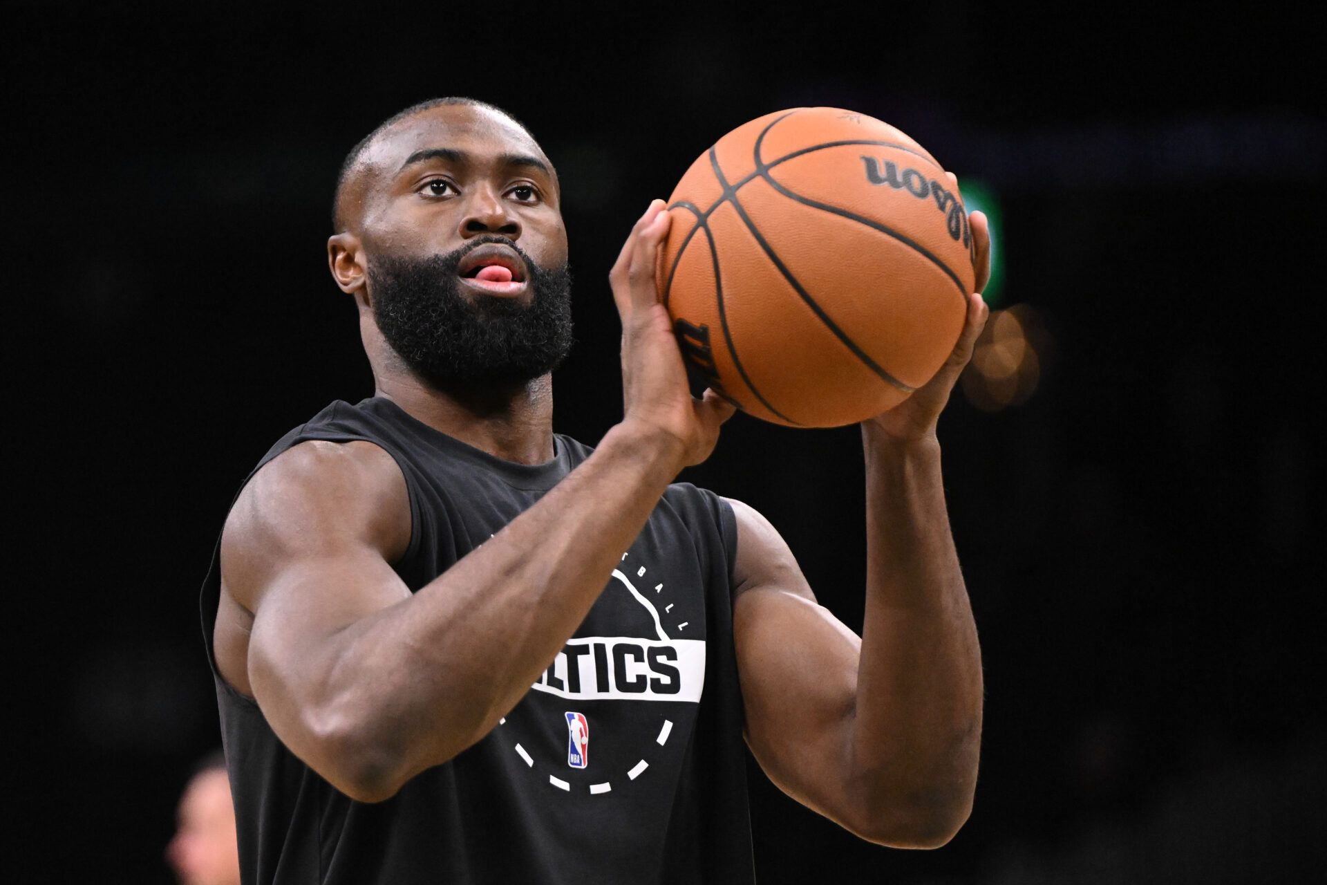 Boston Celtics guard Jaylen Brown (7) takes a shot during warmups before a game against the Phoenix Suns at the TD Garden.
