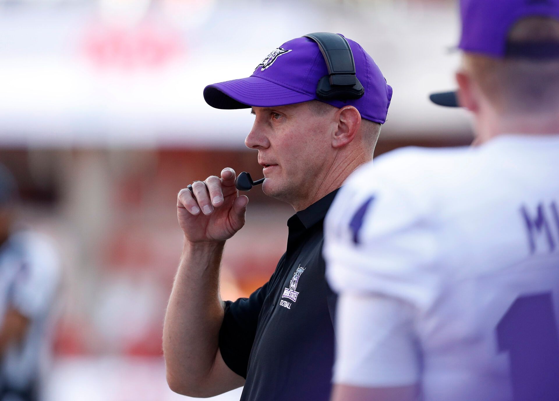 Weber State Wildcats head coach Jay Hill keeps an eye in his team from the sidelines in the first quarter against the Utah Utes at Rice-Eccles Stadium.
