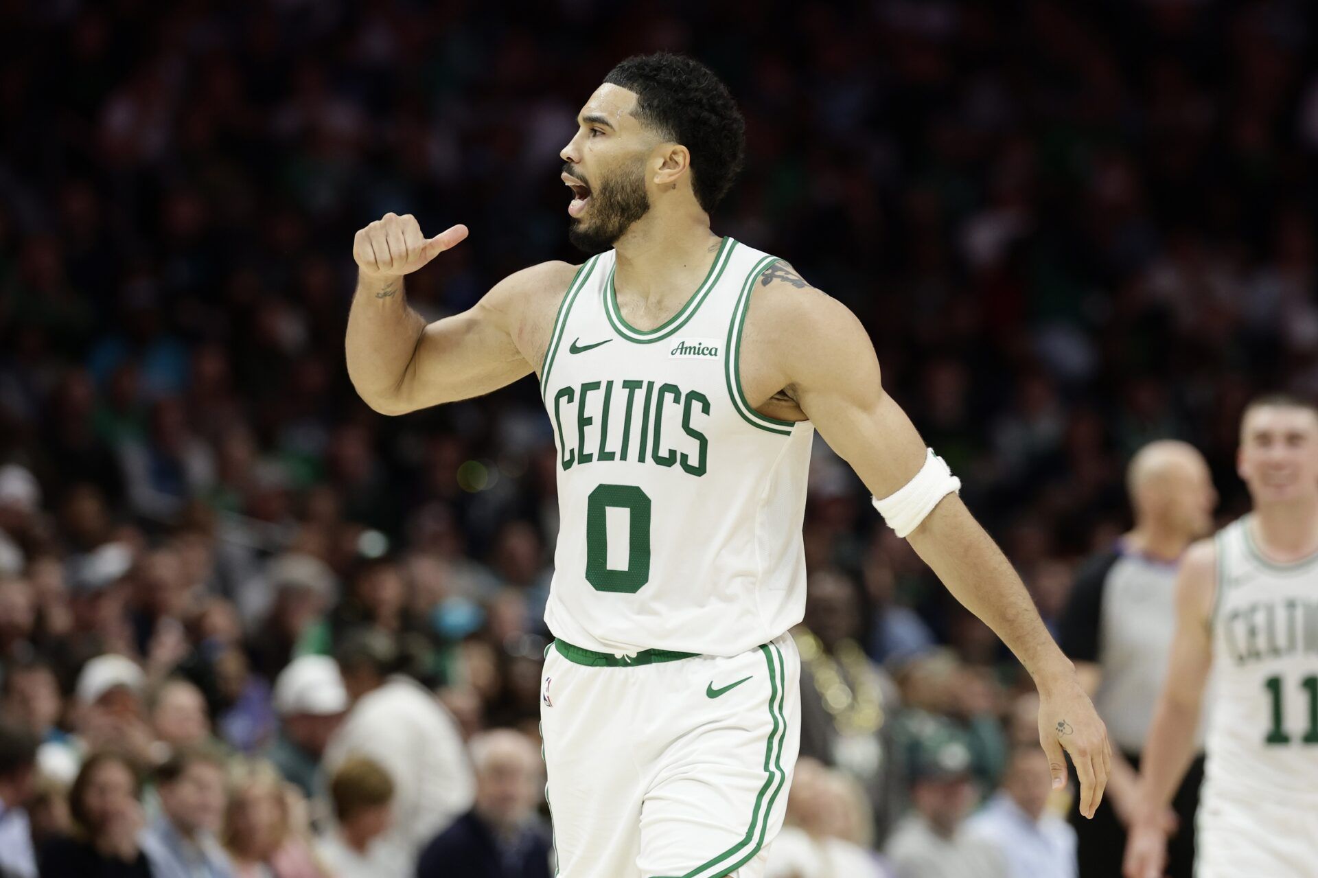 Boston Celtics forward/guard Jayson Tatum (0) reacts to the crowd after making a basket during the second half against the Charlotte Hornets at Spectrum Center.
