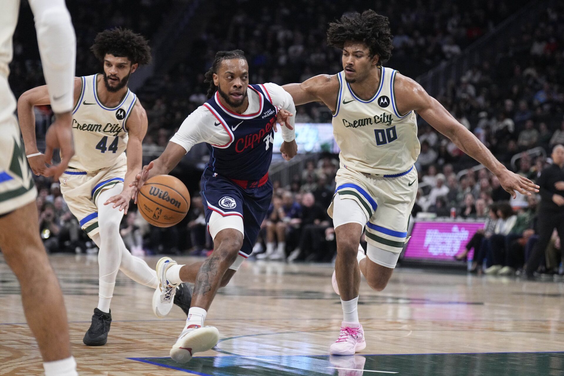 LA Clippers guard Darius Garland (10) drives against Milwaukee Bucks center Jericho Sims (00) in the first half at Fiserv Forum.