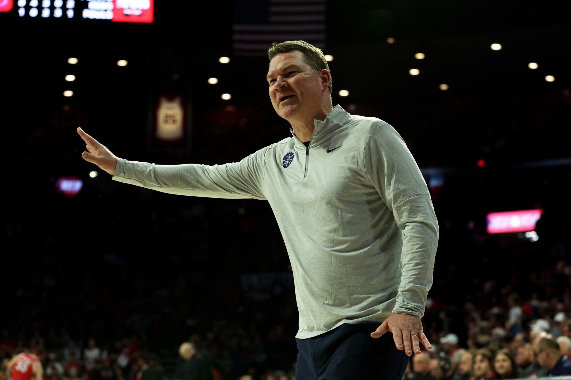 Arizona Wildcats head coach Tommy Llyod talks to the referee from the sidelines against the Utah Utes during the second half at McKale Center.