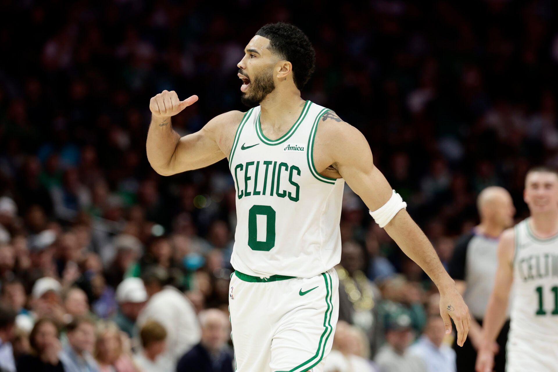 Boston Celtics forward/guard Jayson Tatum (0) reacts to the crowd after making a basket during the second half against the Charlotte Hornets at Spectrum Center.
