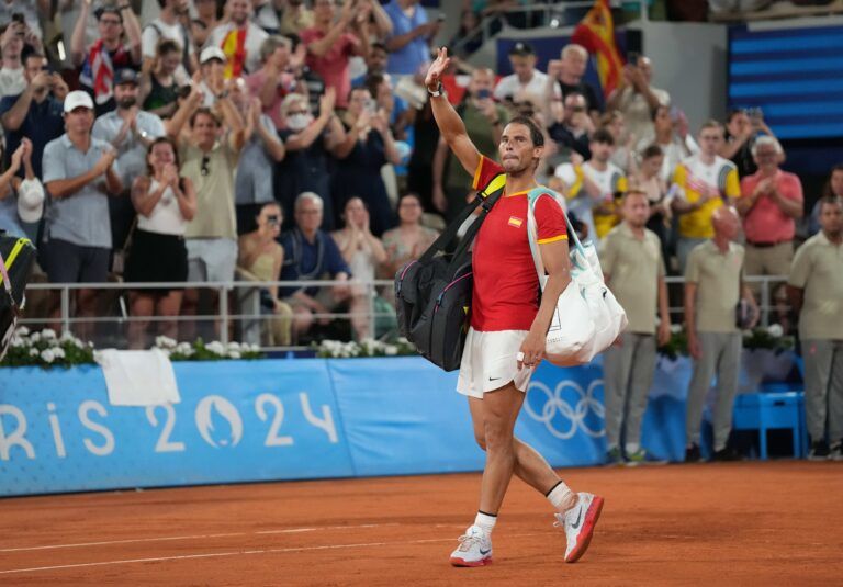 Rafael Nadal (ESP) waves to the crowd after losing to Austin Krajicek and Rajeev Ram (USA) in a men's doubles quarterfinal tennis match during the Paris 2024 Olympic Summer Games at Stade Roland Garros.