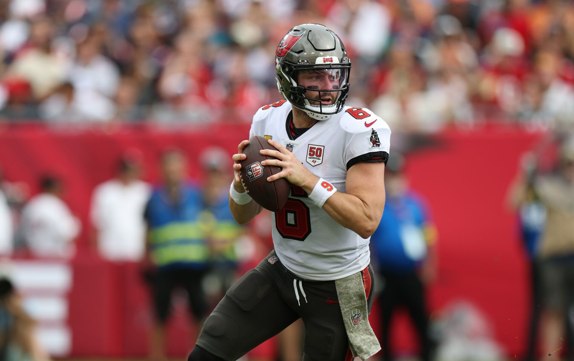 Tampa Bay Buccaneers quarterback Baker Mayfield (6) runs in the pocket during the second quarter against the New England Patriots at Raymond James Stadium.