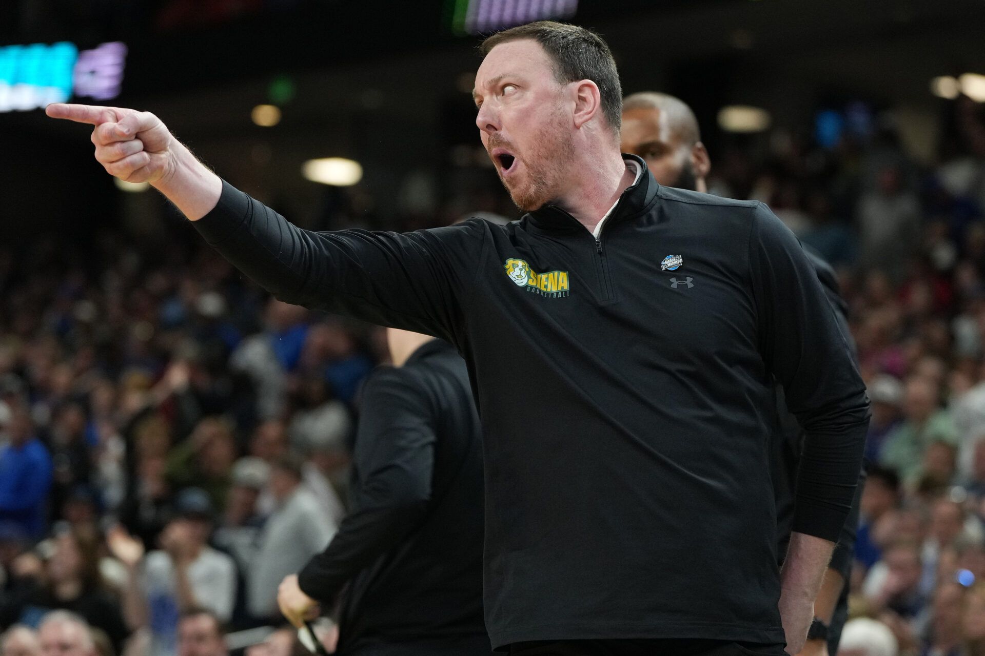 Siena Saints head coach Gerry McNamara reacts against the Duke Blue Devils in the second half during a first round game of the men's 2026 NCAA Tournament at Bon Secours Wellness Arena.