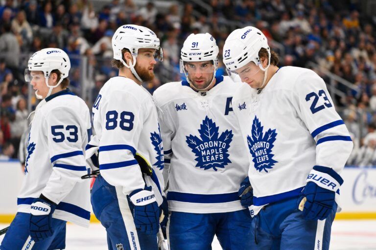 Toronto Maple Leafs right wing William Nylander (88) center John Tavares (91) and left wing Matthew Knies (23) talk before a face off against the St. Louis Blues during the third period at Enterprise Center.
