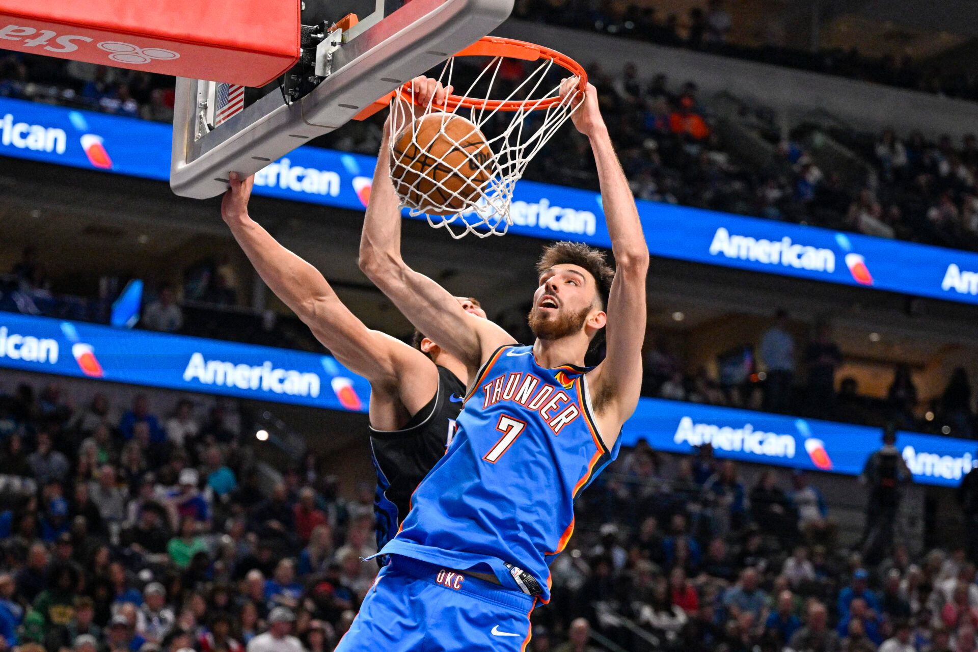 Oklahoma City Thunder center Chet Holmgren (7) dunks the ball past Dallas Mavericks forward Dwight Powell (7) during the second half at the American Airlines Center.