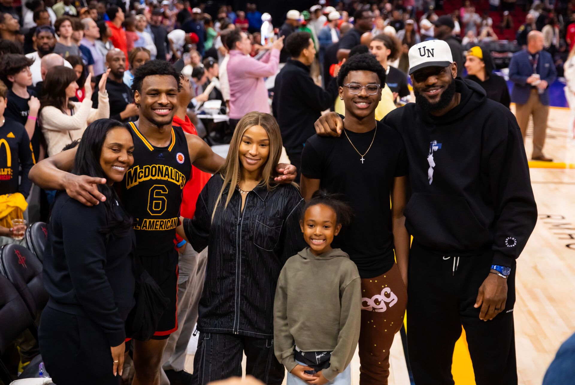 West guard Bronny James (6) poses for a family photo with grandmother Gloria Marie James, mother  Savannah James , brother Bryce Maximus James, sister Zhuri Nova James and father LeBron James following the McDonald's All American Boy's high school basketball game at Toyota Center.