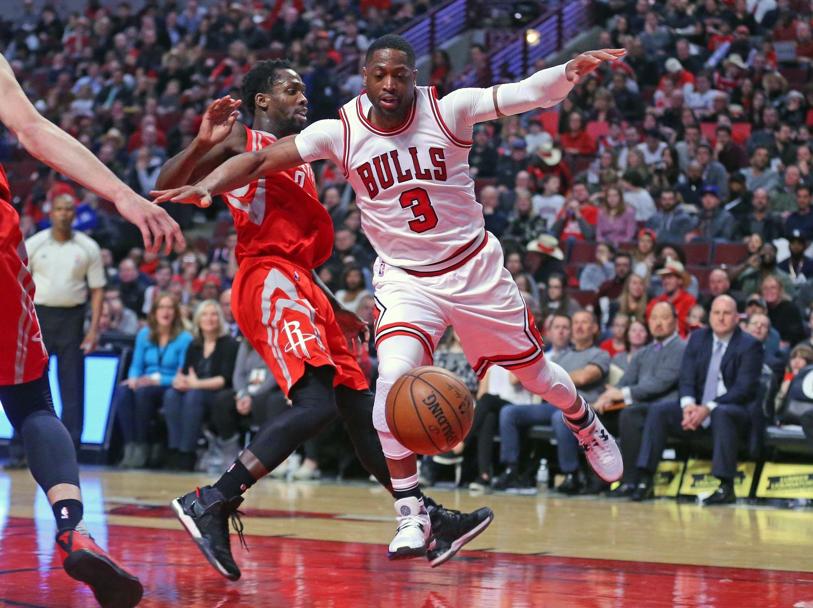 Houston Rockets guard Patrick Beverley (2) strips the ball from Chicago Bulls guard Dwyane Wade (3) during the first half at the United Center.