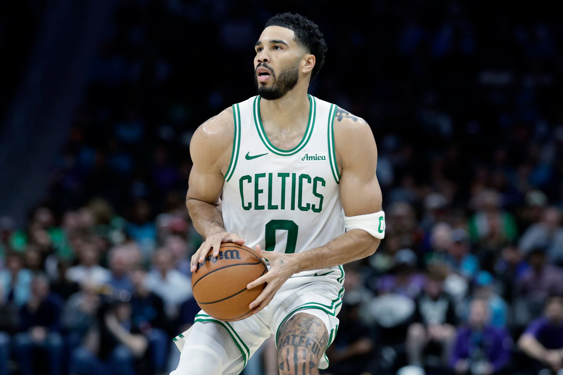 Boston Celtics forward/guard Jayson Tatum (0) prepares to attempt a jump shot during the second quarter against the Charlotte Hornets at Spectrum Center.