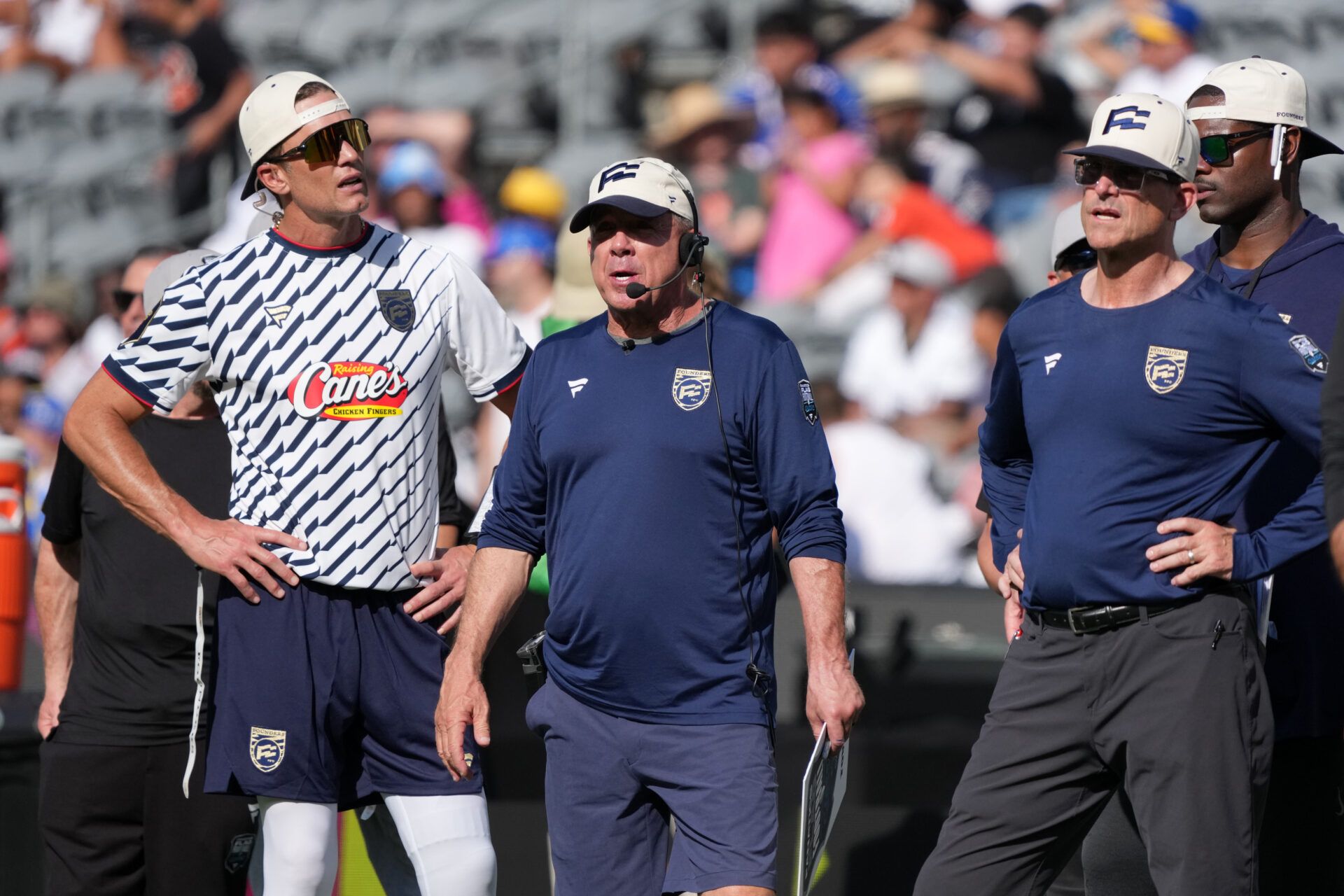 Founders FFC quarterback Tom Brady (left) and coaches Sean Payton (center) and Jim Harbaugh react during the Fanatics Flag Football Classic at BMO stadium.