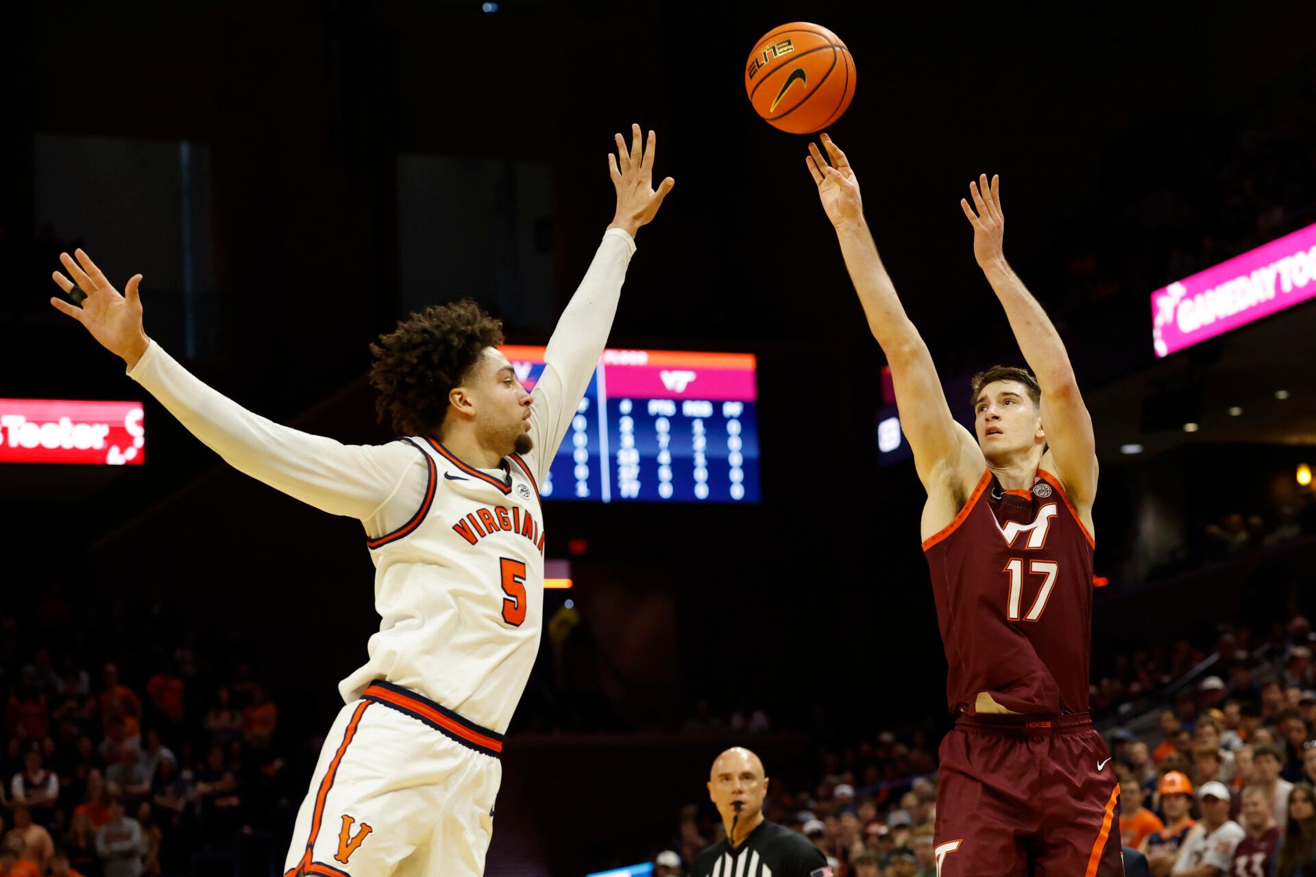 Virginia Tech Hokies guard Neoklis Avdalas (17) shoots the ball over Virginia Cavaliers guard Sam Lewis (5) in the first half at John Paul Jones Arena.
