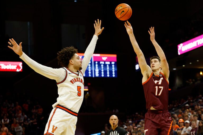 Virginia Tech Hokies guard Neoklis Avdalas (17) shoots the ball over Virginia Cavaliers guard Sam Lewis (5) in the first half at John Paul Jones Arena.