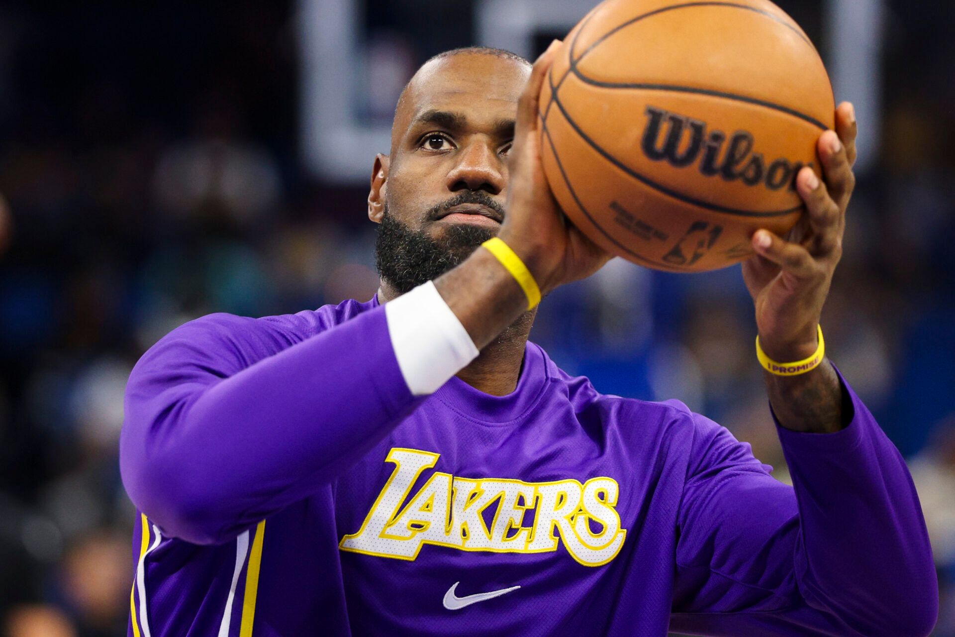 Los Angeles Lakers forward LeBron James (23) warms up before a game against the Orlando Magic at Kia Center.