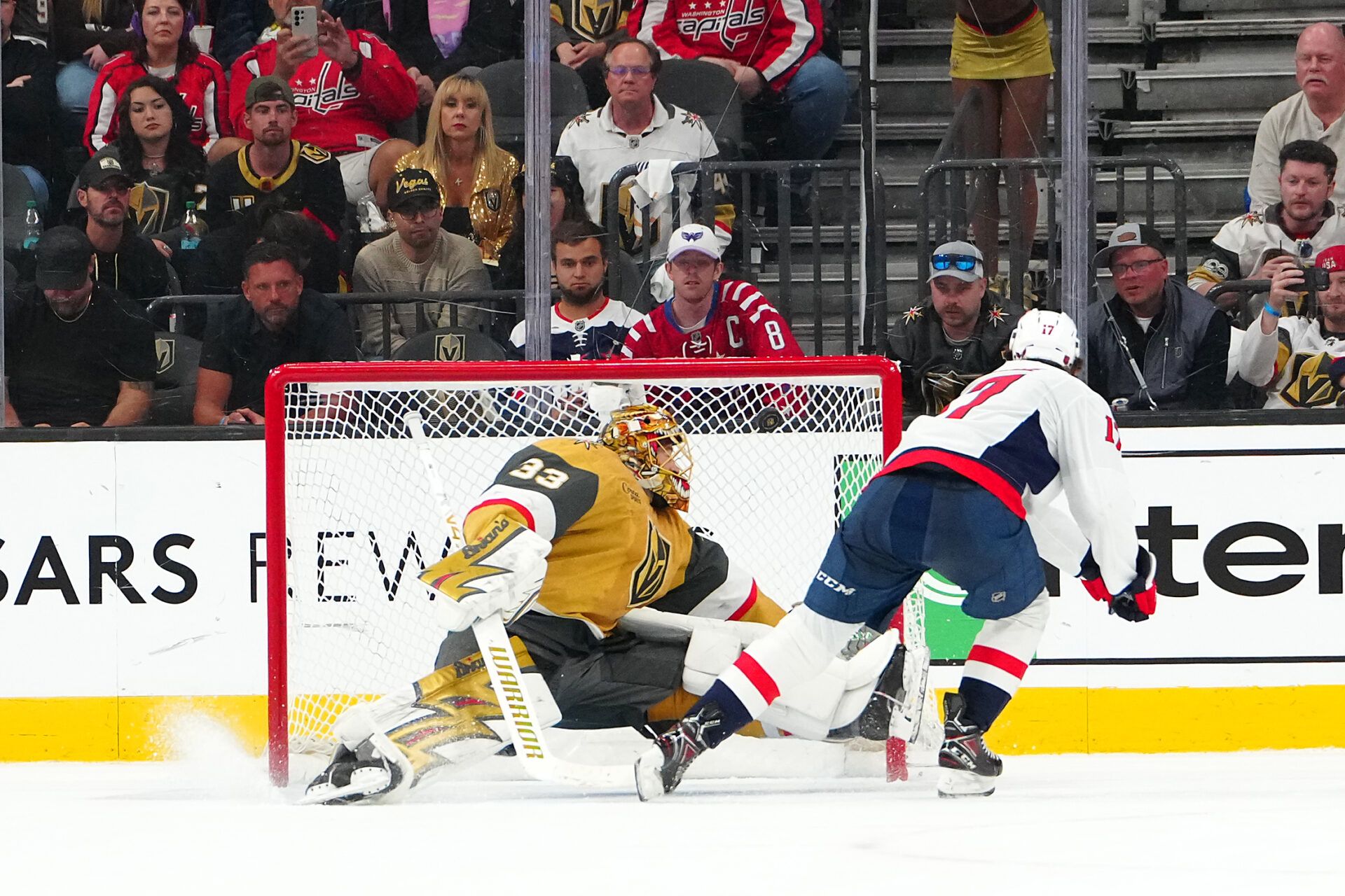 Washington Capitals center Dylan Strome (17) scores against Vegas Golden Knights goaltender Adin Hill (33) during a shoot-out at T-Mobile Arena.