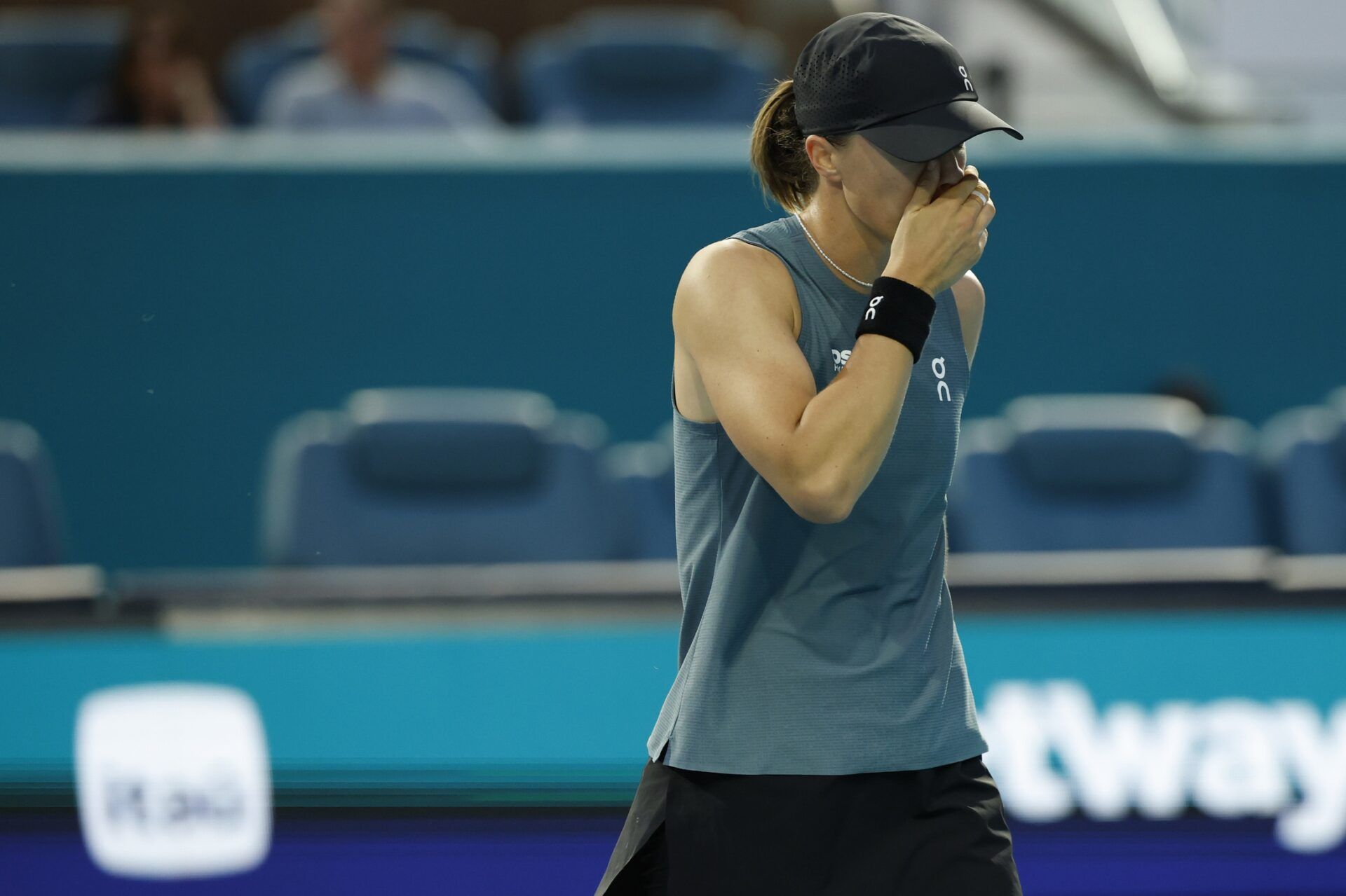 Iga Swiatek (POL) reacts after missing a shot against Magda Linette (POL) (not pictured) on day three of the 2026 Miami Open at Hard Rock Stadium.
