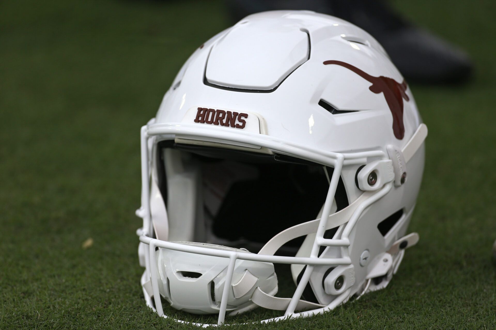 A Texas Longhorns helmet sits on the field prior to the game against the Mississippi State Bulldogs at Davis Wade Stadium at Scott Field.