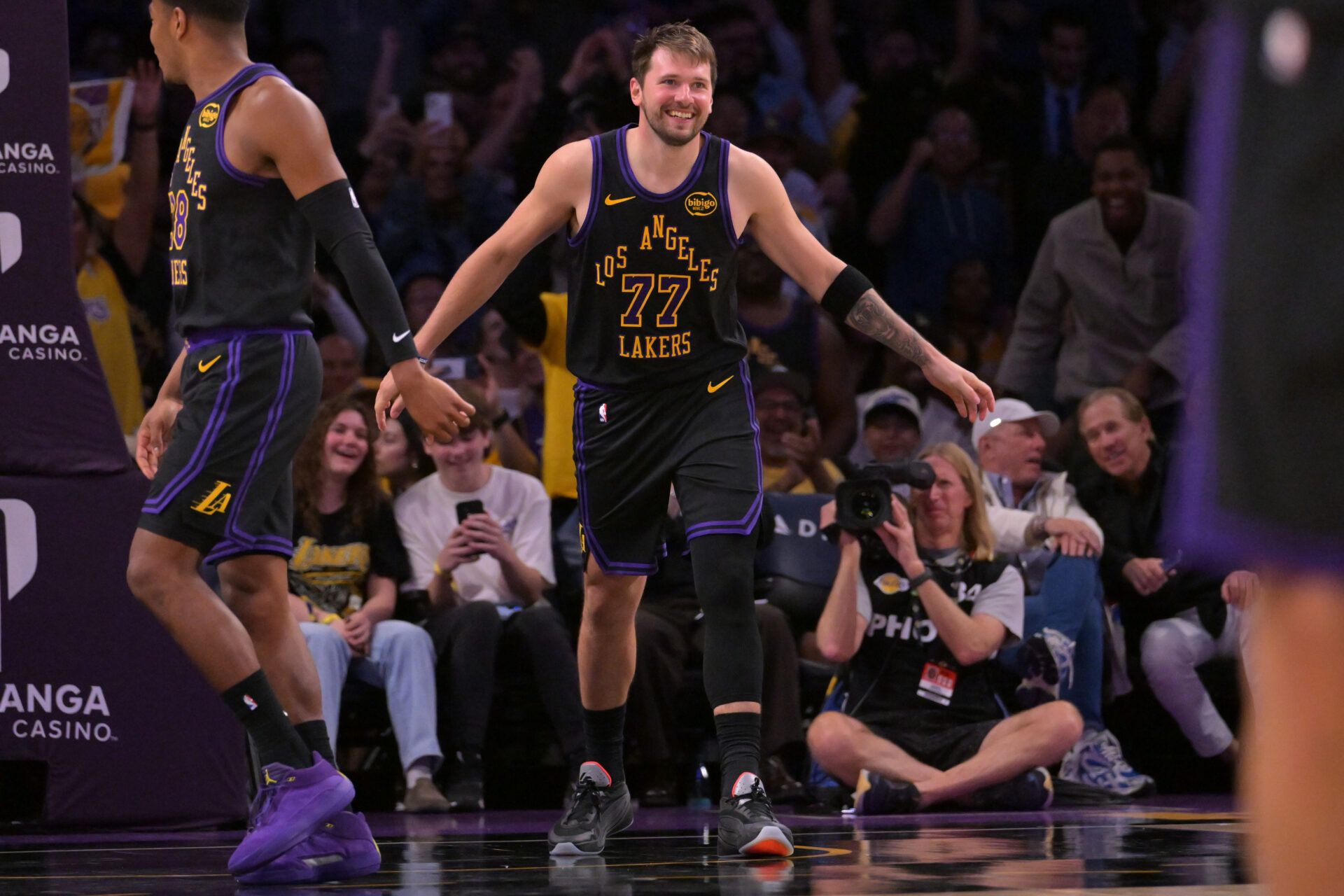 Los Angeles Lakers guard Luka Doncic (77) smiles after a dunk in the final minutes of the game against the Cleveland Cavaliers at Crypto.com Arena.