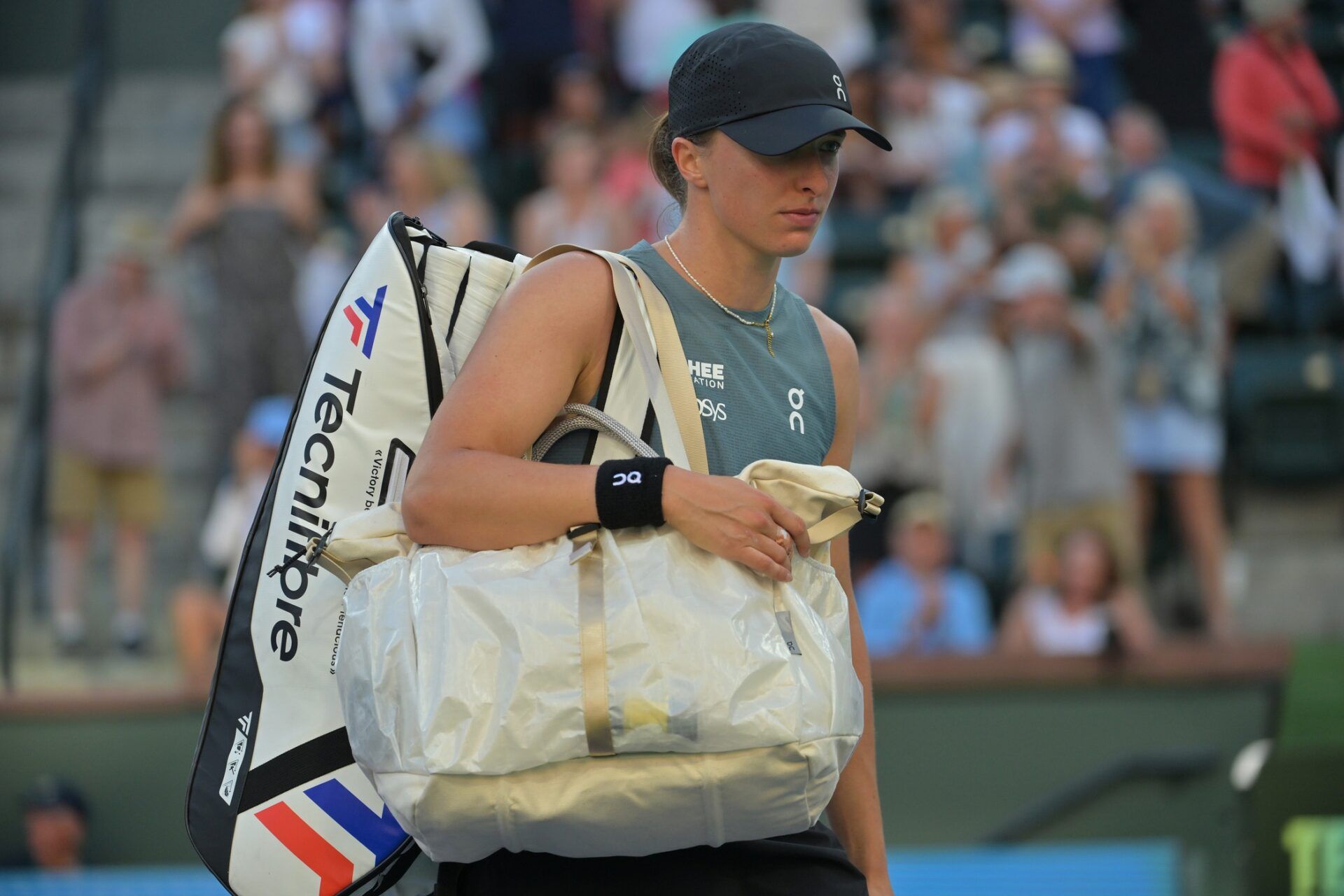Iga Swiatek (POL) leaves the court after she lost her quarterfinal match to Elina Svitolina (UKR) during the BNP Paribas Open at the Indian Wells Tennis Garden.