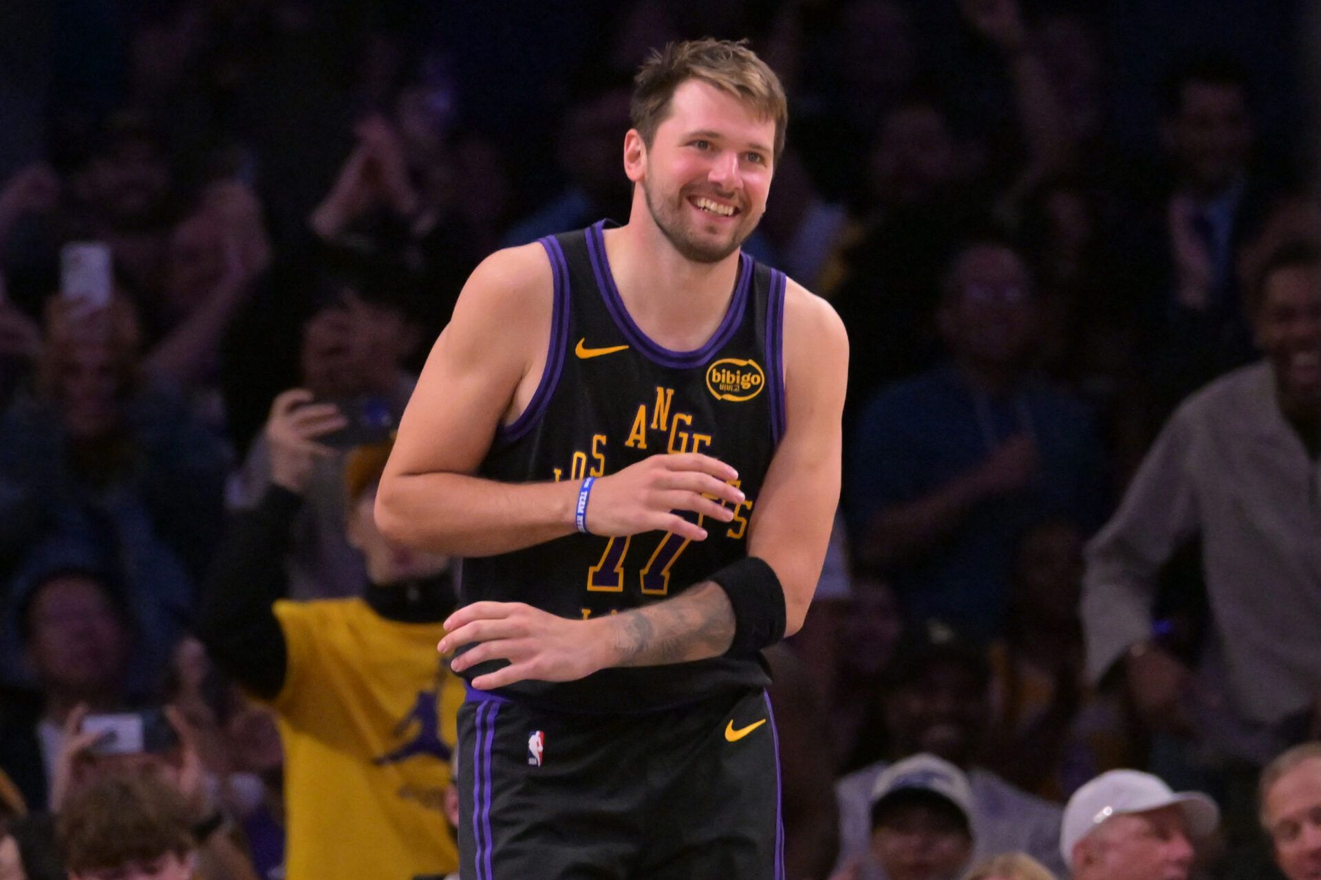 Los Angeles Lakers guard Luka Doncic (77) smiles after a dunk in the final minutes of the game against the Cleveland Cavaliers at Crypto.com Arena.