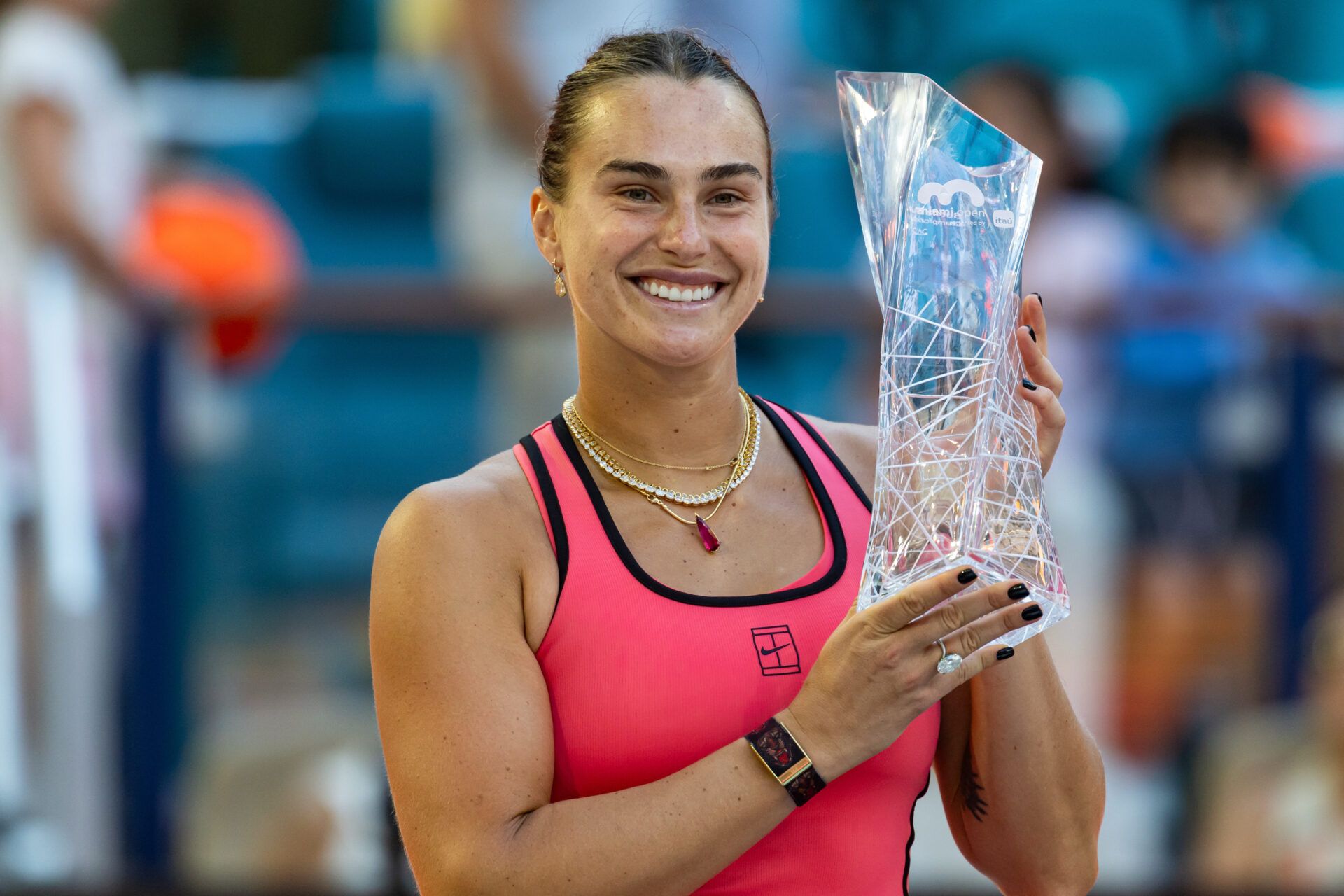 Aryna Sabalenka of Belarus poses with the Butch Buchholz Championship trophy after defeating Coco Gauff of the United States in the final of the womenÕs singles at the Hard Rock Stadium.