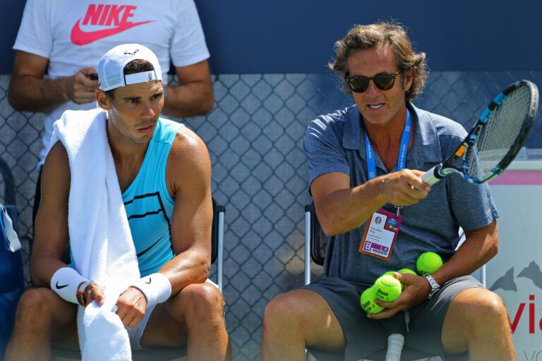 Rafael Nadal (ESP) talks with Francisco Roig (right) on the practice court during the Western and Southern Open at Lindner Family Tennis Center.